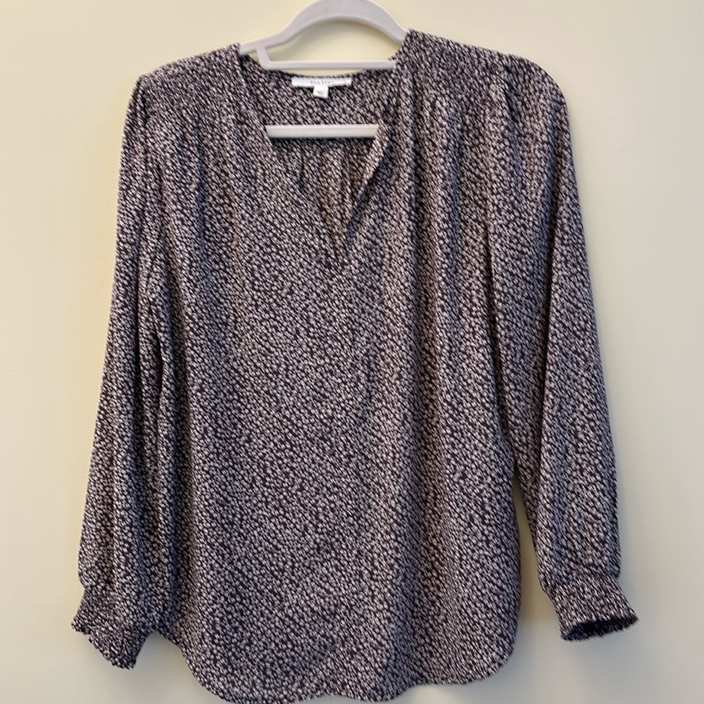 Purple blouse with white flowers.  Elastic sleeve.  Flowy. Never worn! Size S.